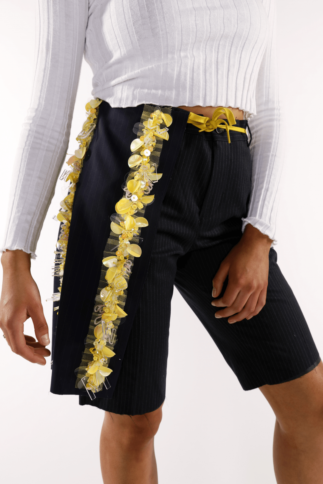 Chunky yellow embroidery on pinstripe